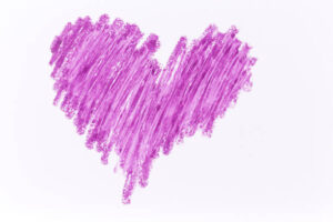 Purple heart crayon draw on white paper