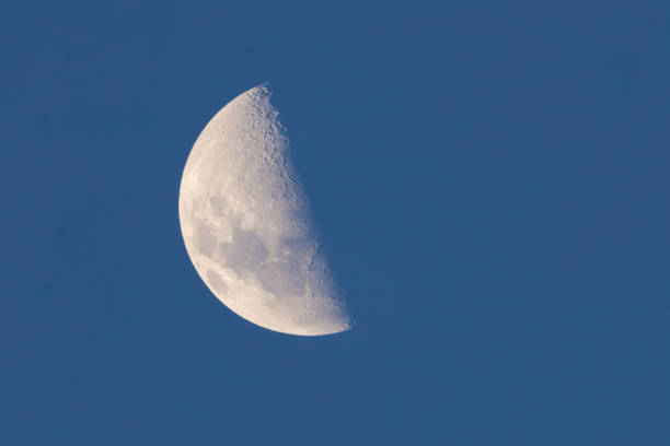 half moon in blue sky